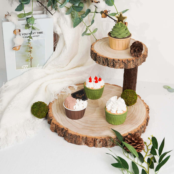 Decorative cupcake display on wooden stand with greenery and festive accents.