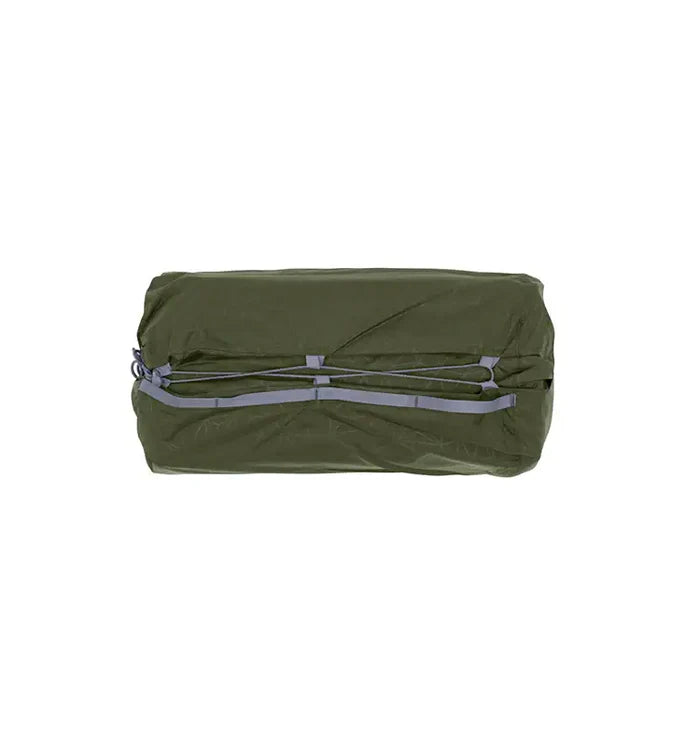 Green compression bag with gray straps on a white background