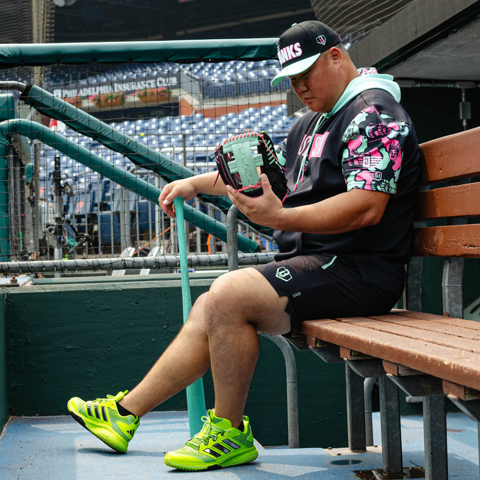 Adult model wearing black shorts with liner with "King Of JUCO Pro Series V2" design