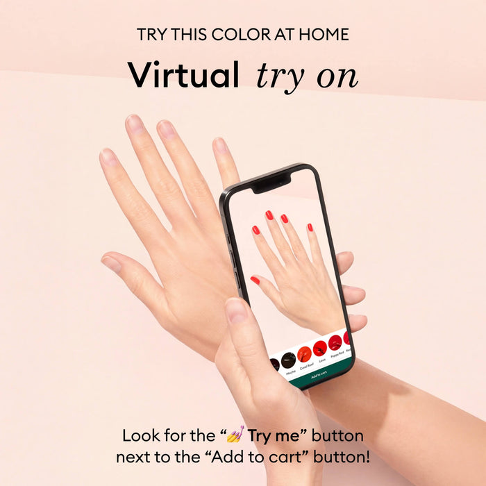 A hand holds a smartphone showing Manucurist’s Prune gel polish in a virtual try-on. Text above invites users to try the deep wine red shade at home using the app’s virtual try-on feature.