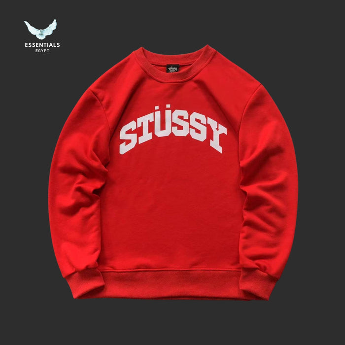 Red Stussy sweatshirt on a black background