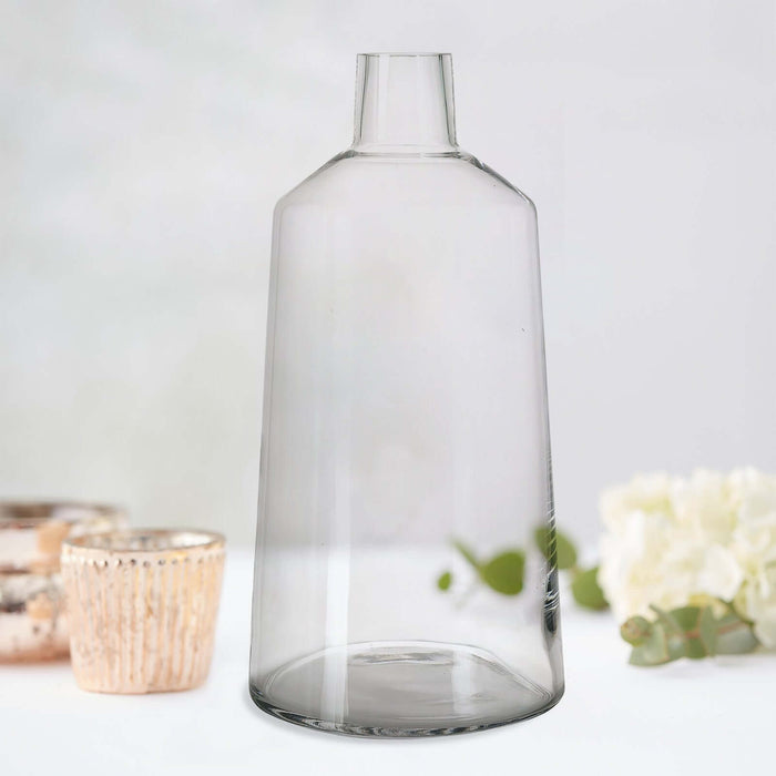Clear glass vase with a smooth, modern design.