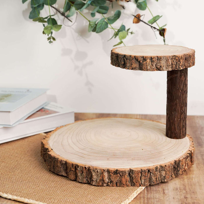 Wooden cake stand with two rustic tiers and natural bark edges.