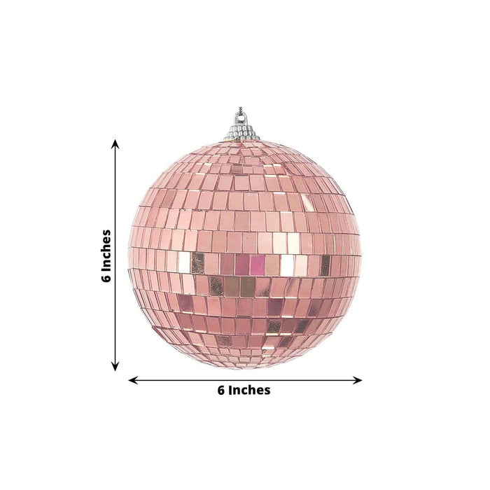 Pink disco ball, 6 inches in diameter, featuring reflective mosaic tiles.