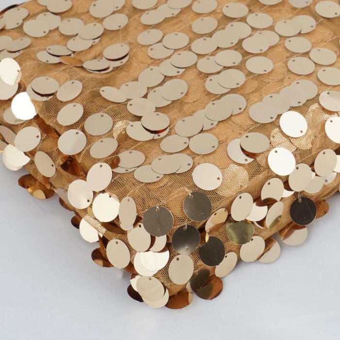 Gold sequin fabric with circular embellishments for crafting or decor.