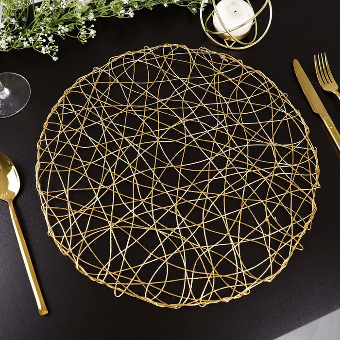 Gold wire decorative charger plate on a black table setting.