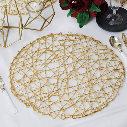 Gold geometric placemat on a dining table setting.