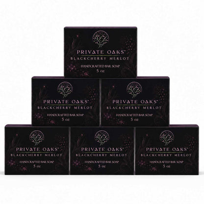 Six boxes of Private Oaks Blackberry Merlot Handcrafted Bar Soap arranged in a pyramid stack on a plain white background.