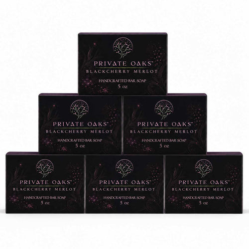 Six boxes of Private Oaks Blackberry Merlot Handcrafted Bar Soap arranged in a pyramid stack on a plain white background.