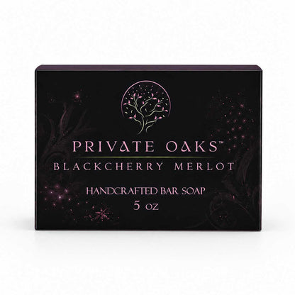 A rectangular black bar soap box for Private Oaks Blackberry Merlot, featuring a pink tree logo and text, set against a plain white background.