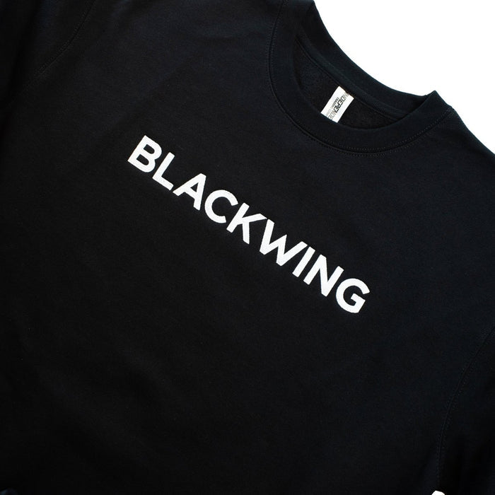 Close-up of a black crewneck sweatshirt with 'BLACKWING' embroidered in white across the chest.
