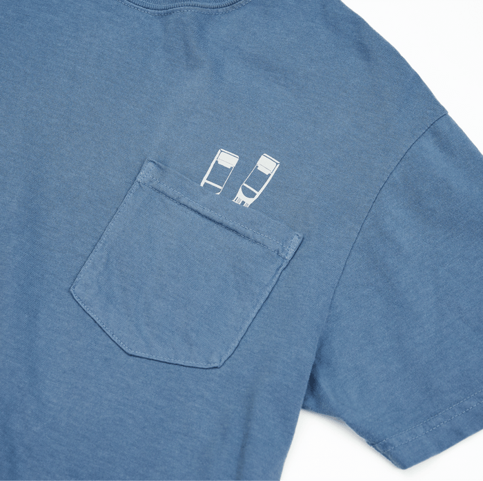 blue cotton t-shirt with 2 white pencil graphics peeking out of the chest pocket. OEKO-TEX certified.