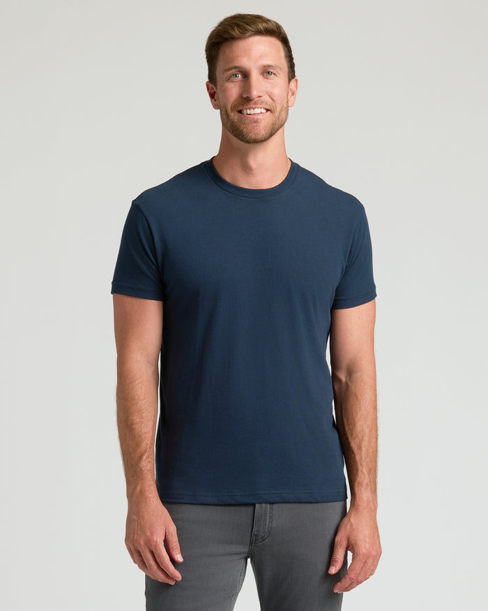 Man in navy Classic Crew Neck T-shirt, relaxed fit.