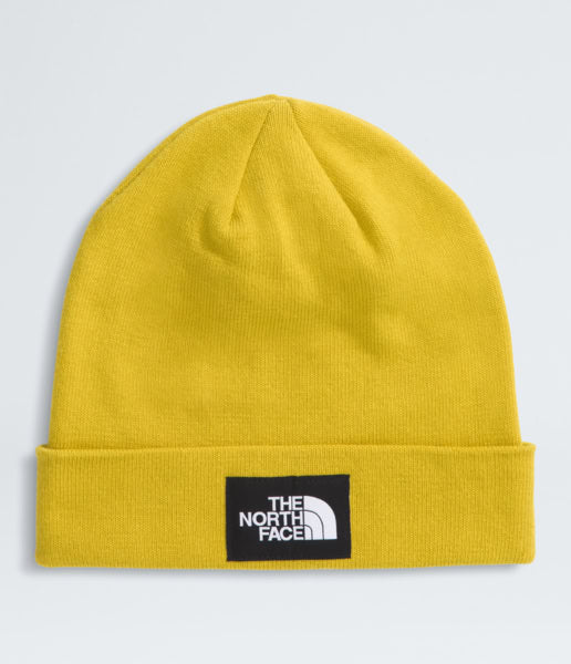 Yellow beanie with The North Face logo on a light gray background