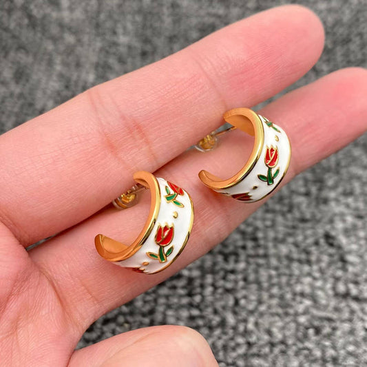 Mio Queena enamel tulip earrings featuring colorful floral design and gold-tone hooks for a stylish accessory.