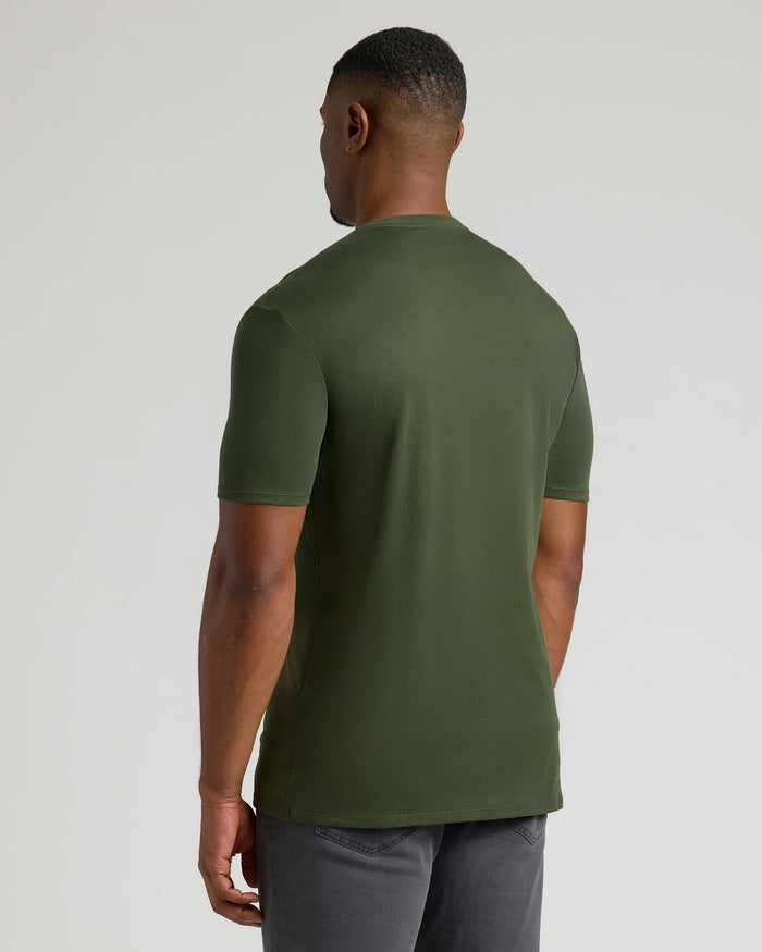 A man wearing an olive green Tall Pima Cotton Blend Crew 4-Pack t-shirt, shown from the back, highlighting the smooth fabric and classic fit of this men's basics essential.