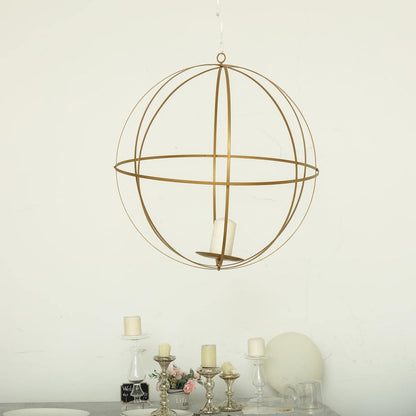 Gold globe pendant light with candle holder, perfect for modern decor.