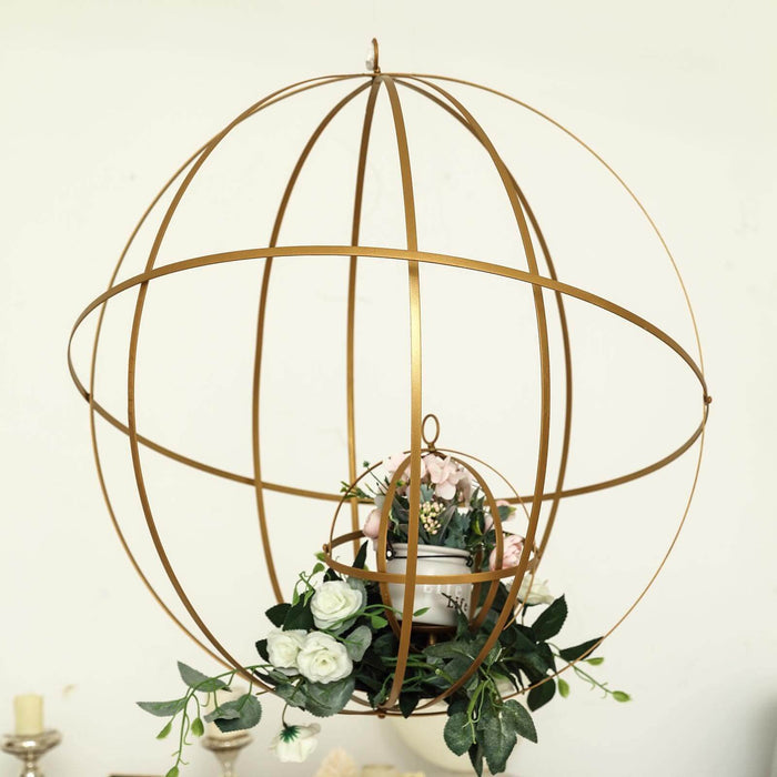 Gold decorative globe with flowers and a planter.