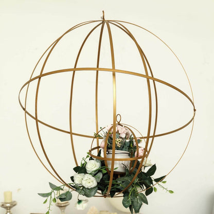 Gold decorative globe with flowers and a planter.