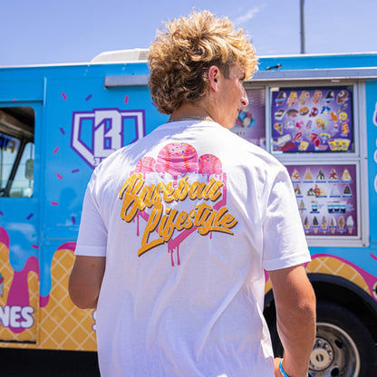 Adult model wearing white Ice Cream Strawberry graphic tee