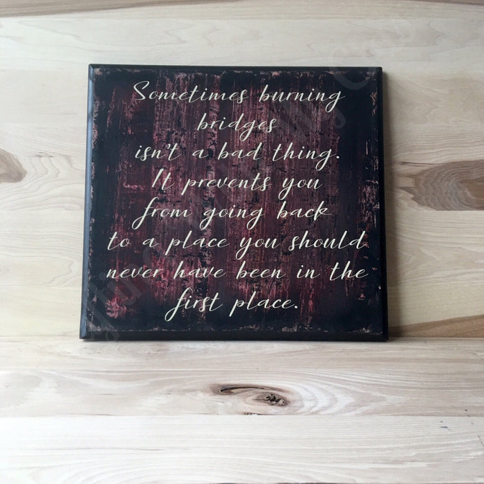 Burning bridges inspirational wooden sign.