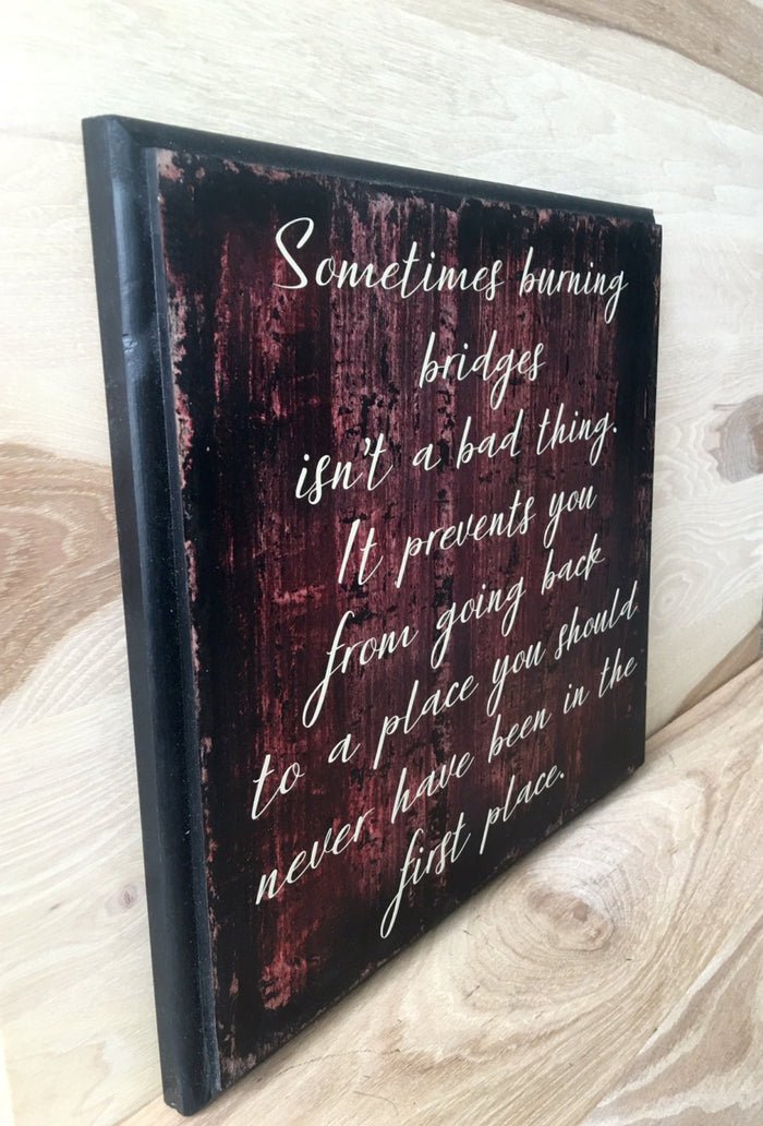 Burning bridges inspirational wooden sign.