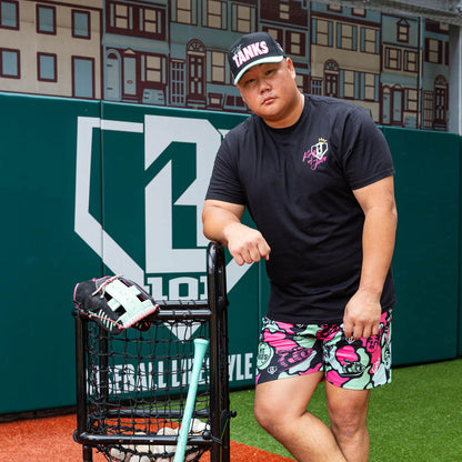 Adult model wearing black shorts with "King Of JUCO" design
