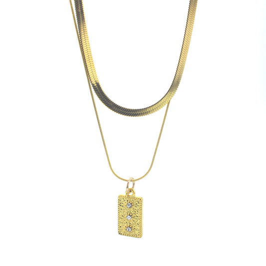 Gold-tone waterproof necklace with layered chain and rectangular stone charm