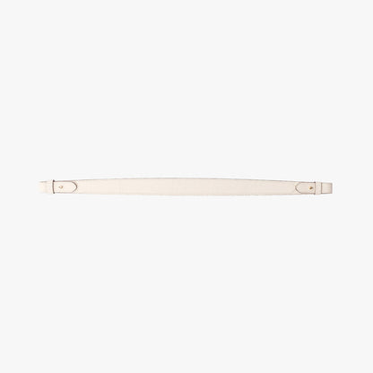 Detachable shoulder strap for STOW London's Curve, Midi Curve and East West in Spring Moon pebbled leather on a light grey background featuring gold hardware