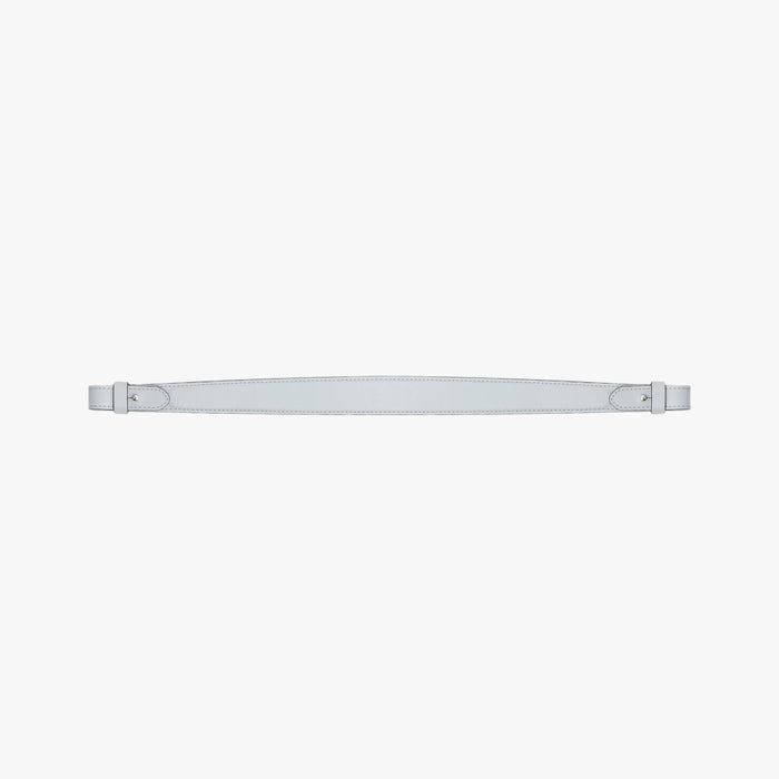 Detachable shoulder strap for STOW London's Curve, Midi Curve and East West in Misty Blue smooth leather on a light grey background featuring gold hardware