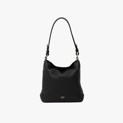 STOW London's Midi Curve and detachable shoulder strap in Black leather on a light grey background featuring gold hardware and details