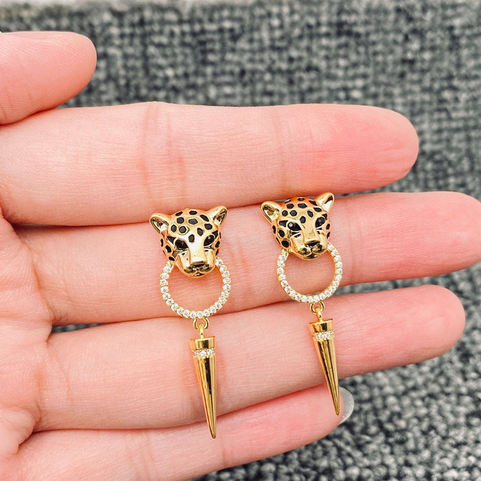 Leopard head earrings by Mio Queena featuring gold-tone earrings with detailed leopard face design for stylish accessories.