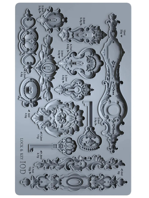 Decorative silicone mold with intricate designs on a gray background