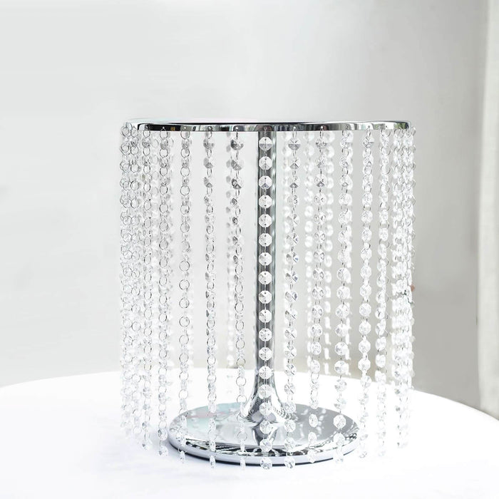 Crystal beaded lamp with a shiny chrome base in studio isolation.