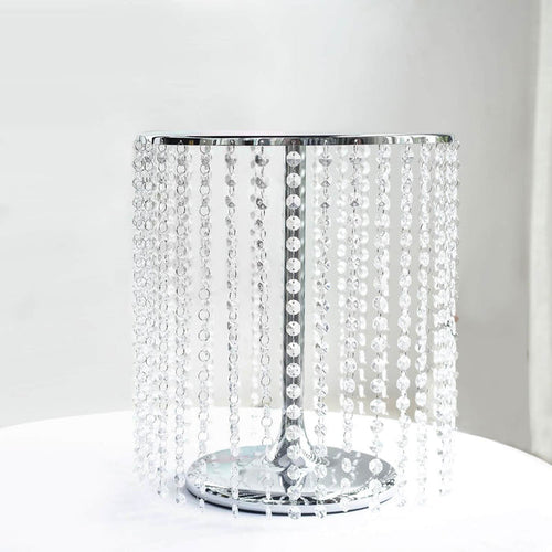 Crystal beaded lamp with a shiny chrome base in studio isolation.