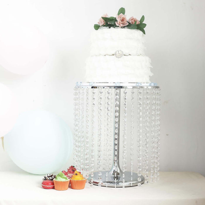 Elegant wedding cake adorned with roses on a decorative stand.