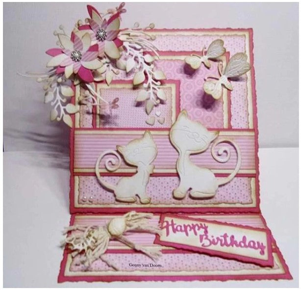 Nellie's Choice - Shape Dies Blue - Strangled Branches with Flowers. This die will cut a circular branch with flowers and berries, and includes 2 additional flower dies to allow you to cut and layer to add dimension to your project. Includes 3 dies. Size: (branch) 4.2 x 3.7 in (flower 1) 1.6 x 1.6 in (flower 2) 1.1 x 1 in. Available at Embellish Away located in Bowmanville Ontairo Canada. Example by designer.