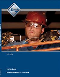Blue cover of the NCCER Basic Safety trainee guide featuring a construction worker wearing safety gear and helmet