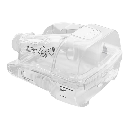 ResMed AirSense 11 humidifier chamber, a transparent water reservoir with a max fill line, labeled for use with distilled water only.