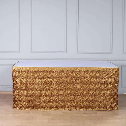 Gold rose textured tablecloth draped over a white table.
