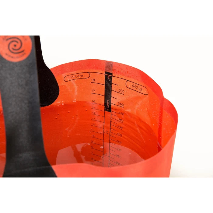 Orange collapsible bucket with black handles on a white background