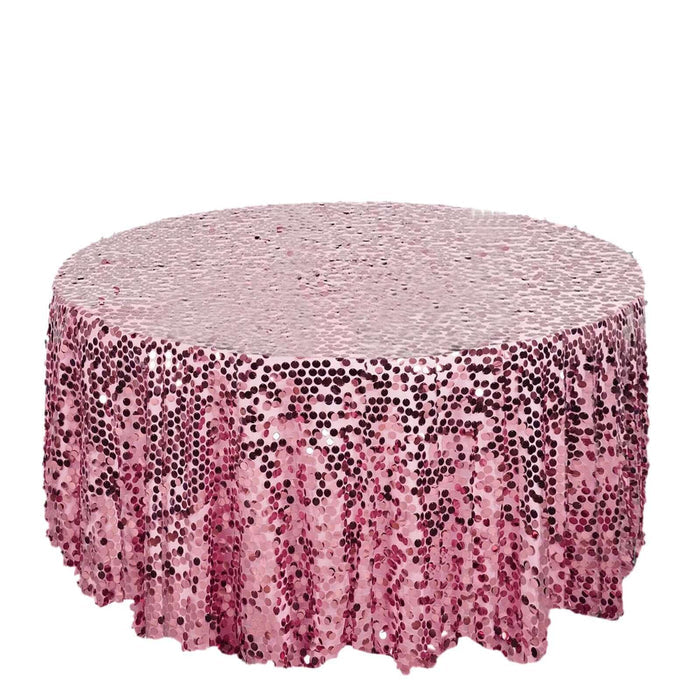 Pink sequin tablecloth with shimmering circular design on a white background.