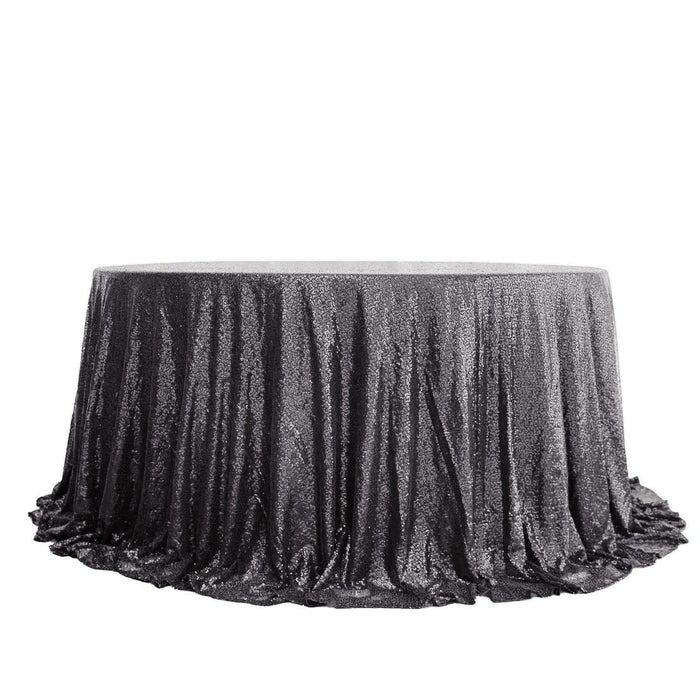 Black sequin tablecloth with elegant draping on a round table