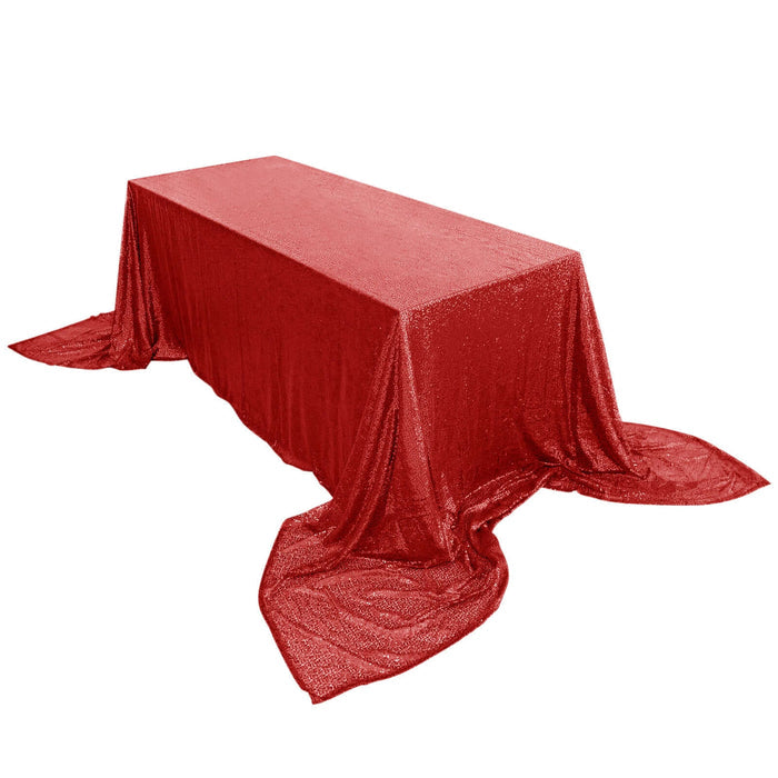 Red glitter tablecloth draped elegantly over a rectangular table