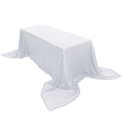 Sparkling silver tablecloth draped over a rectangular table