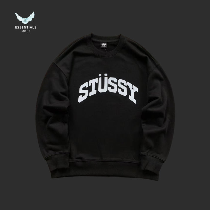 Black Stussy sweatshirt on a dark background