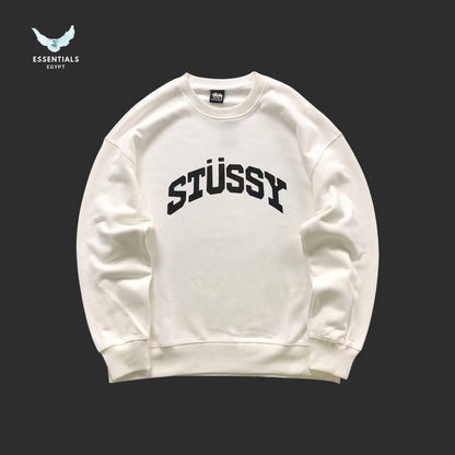 White Stussy sweatshirt on a black background