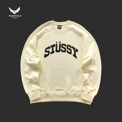 White Stussy sweatshirt on a black background