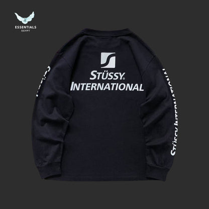 Stussy International shirt with sleeve branding and relaxed fit