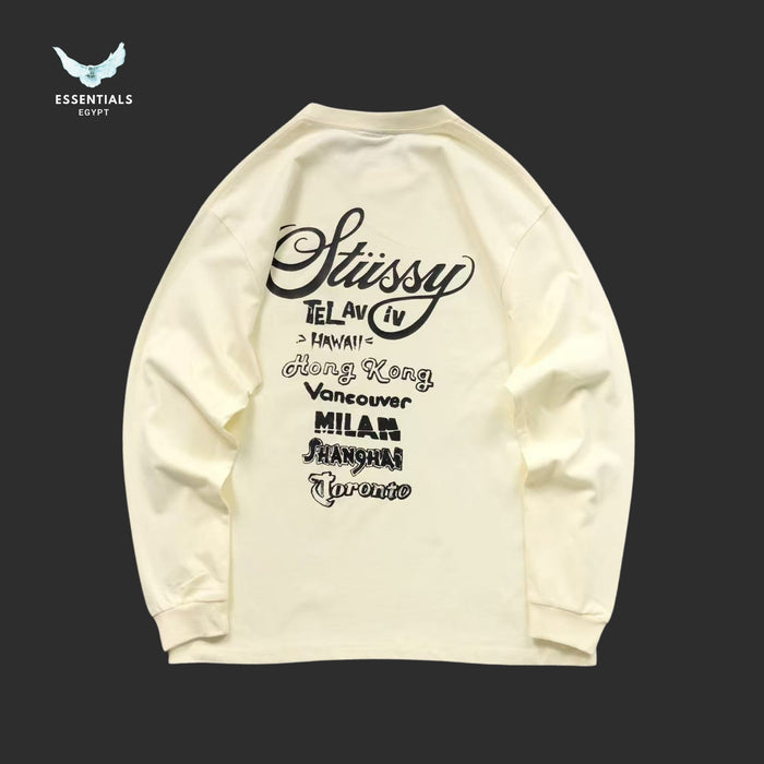 Cream Stussy long sleeve sweatshirt with World Tour front graphic